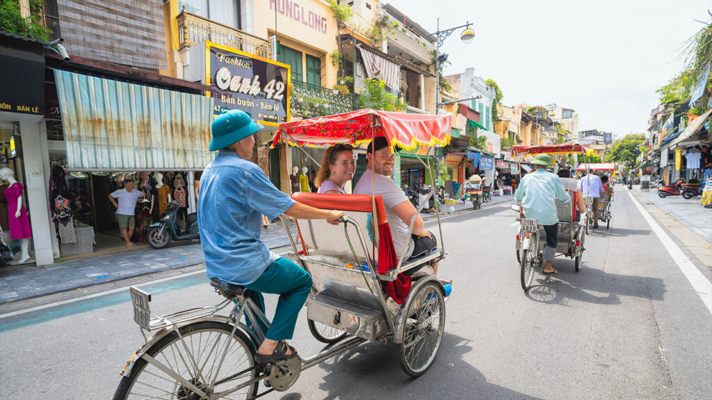 Reisende in Fahrradrikscha